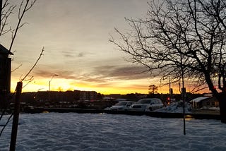 Snowy urban sunset