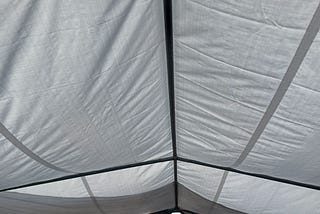 white poly tarp used as tent covers