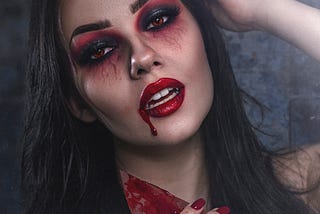 A woman dressed up as a vampire.