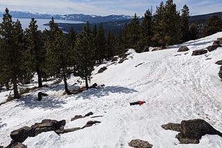 A woman lying down in the snow