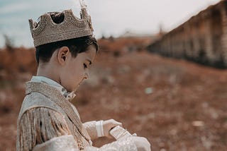 Boy Wearing A King Costume