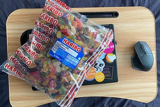 3kg of jelly babies on top of a laptop.