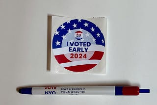 An “I voted early 2024” sticker with a pen
