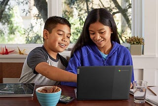 Two students using a Chromebook.