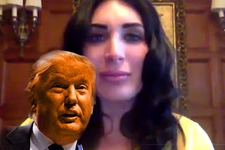 Image of Laura Loomer with a smaller, orange Trump in front of her.