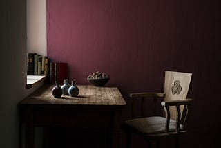 Empty chair in front of desk