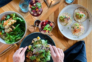 A vegan meal with plates full of plant-based food