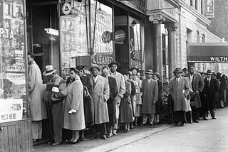 Line of Black voters waiting outside a polling place in Harlem
