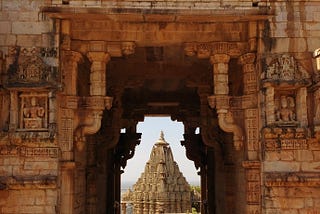 An intricately designed Hindu temple and its towering structure.