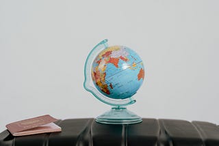 Photo by Tima Miroshnichenko: https://www.pexels.com/photo/globe-beside-a-passport-7009465/