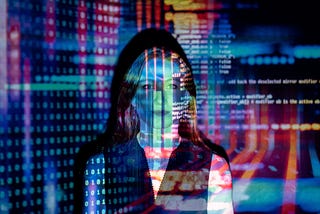 Woman overshadowed with a film image of computer code