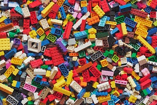 jumbled pile of brightly colored plastic building blocks