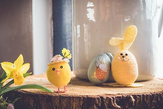 Cute easter toys: toy chicken, plushy rabbit and a painted egg