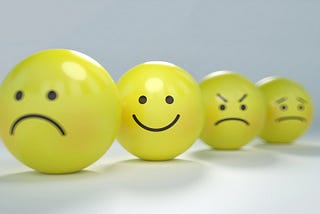 Emoticons with frown, smile, angry face, worried face