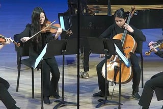 Tulio playing the viola with 3 other students