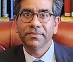 A headshot of Dr Arun Chopra, Chief Inspector of Mental Health at CQC