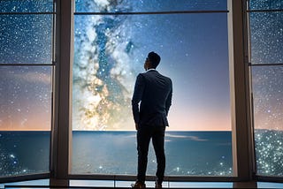 A budding entrepreneur looking outside the window