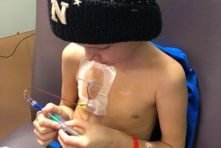 Sully, a little boy, receiving cancer treatment.