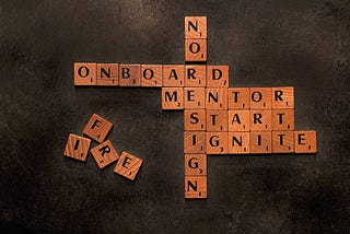 Mentor, Start, Ignite Image in scrabble form to link code documentation with software engineer onboarding.