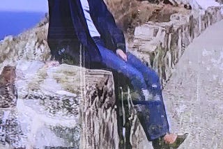 Deana Wild posing near the cliffs of Seal Beach in stilletos