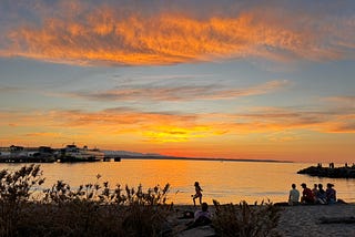 An orange and blue sunset against the Puget Sound.