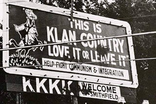 KKK Billboard from the 1970s saying, “This is Klan country. Love it or leave it.”