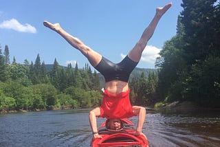 Bichodomato picture in the wild. Headstand on a kayak. Medium blog.