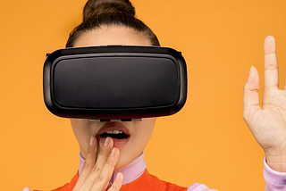 woman in long sleeve shirt surprised in virtual reality