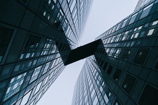 Image of two buildings connected via skybridge symbolizing creating account relationships inside Salesforce