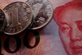 China’s Surprise Rate Cut: Balancing Stimulus Amid Yuan Concerns