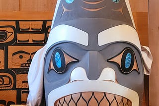 A white and grey mask for traditional Haida ceremonies