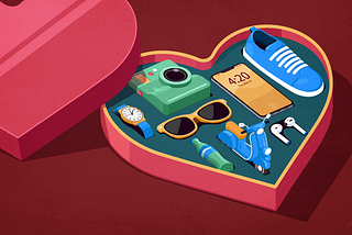 Heart-shaped box with various objects inside, including a camera, watch, sunglasses, smartphone, shoe, soda bottle, vespa and wireless headphones.