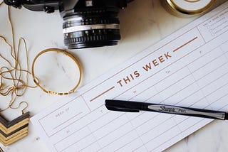 Weekly Calendar with pen — Photo by Jazmin Quaynor on Unsplash