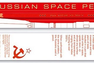 a Russian space pen a pencil in red.