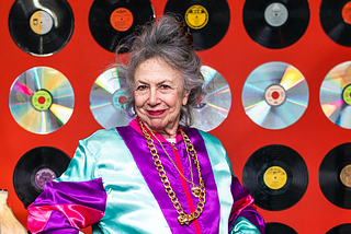 elderly woman wearing a colorful outfit