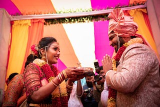 Bride and Groom performing rituals in wedding