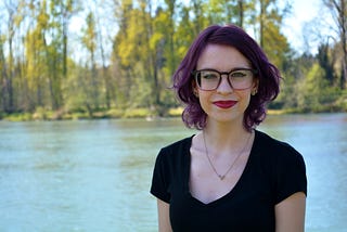 A photo of the author in front of a river