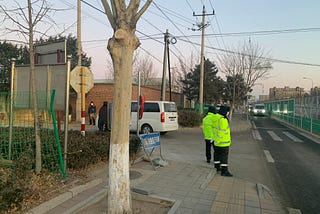 Police guarding the entrance of a funeral home in Miyun, in Beijing, in late December. They reportedly turned away reporters who went to talk to relatives of people who died of Covid.