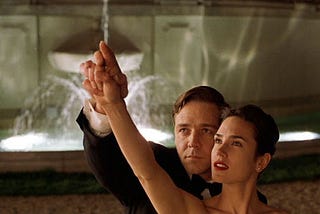 screengrab of John Nash (Russell Crowe) and Alicia Larde (Jennifer Connely) from the film “A Beautiful Mind.”