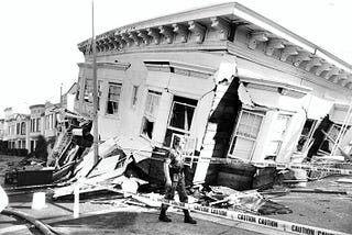 A soldier patrols in front of a destroyed apartment building in SF’s Marina district after the 1989 Loma Prieta earthquake, which destroyed 35 buildings in the neighborhood and thousands more across the Bay Area.