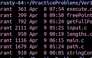 What happens when you type `ls -l *.c` in the shell.