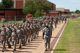 Military recruits marching in formation during basic training