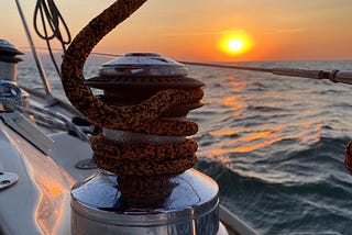 Sailing yacht winch and sunset