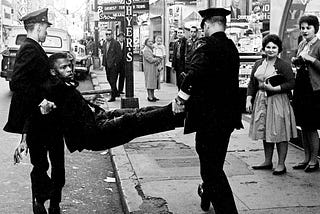 Congressman John Lewis being carried away by police after a sit in. Nashville TN circa 1960s