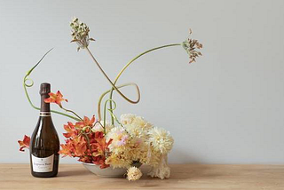 Artisan Champagne bottle with flower arrangment