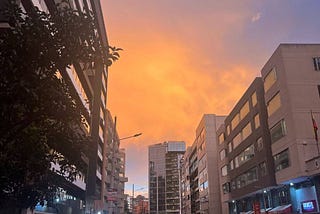 A purple and orange sunset in downtown Qutio, Ecuador