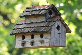A big birdhouse with many entrances