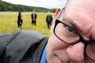 Singer Robert Lloyd and members of The Nightingales in the background.