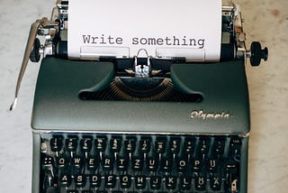 Typewriter with the words Write Something on the paper