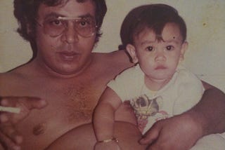 This is me and my dad circa 1984. I was about 8 months old.